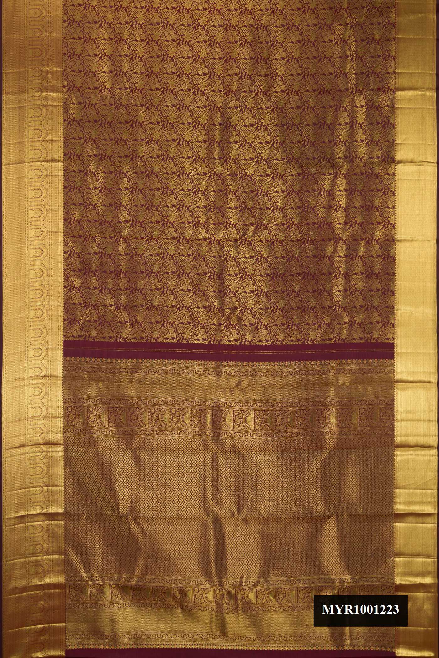 Maroon Dual Tone Kanchipuram Silk Saree with Zari Brocade on the body and Fancy Border.  displayed on a mannequin