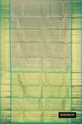 Gold Dual Tone Kanchipuram Tissue Silk Saree with Zari Brocade on the body and Fancy Border.  displayed on a mannequin