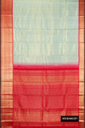 Pista Green Dual Tone Kanchipuram Silk Saree with Zari Butta on the body and Zari Border.  displayed on a mannequin