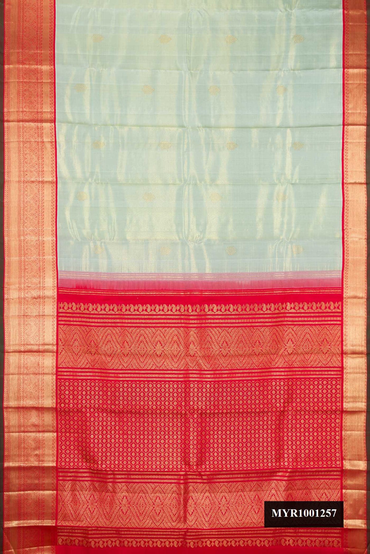 Pista Green Dual Tone Kanchipuram Silk Saree with Zari Butta on the body and Zari Border.  displayed on a mannequin
