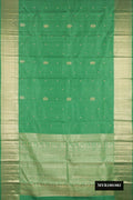 Pista Green Dual Tone Kanchipuram Silk Saree with Zari Butta on the body and Zari Border.  displayed on a mannequin