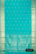 Sky Blue Dual Tone Kanchipuram Silk Saree with Zari Butta on the body and Zari Border.  displayed on a mannequin