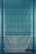 Peacock Blue Dual Tone Kanchipuram Silk Saree with Checked design on the body and Fancy Border.  displayed on a mannequin