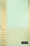 Pista Green Dual Tone Kanchipuram Silk Saree with Zari Butta on the body and Zari Border.  displayed on a mannequin