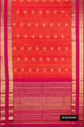 Orange Dual Tone Kanchipuram Silk Saree with Zari Butta on the body and Zari Border.  displayed on a mannequin