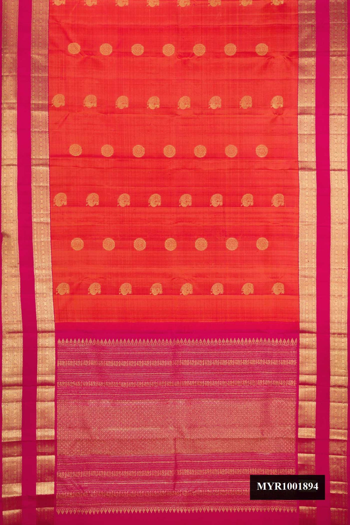 Orange Dual Tone Kanchipuram Silk Saree with Zari Butta on the body and Zari Border.  displayed on a mannequin