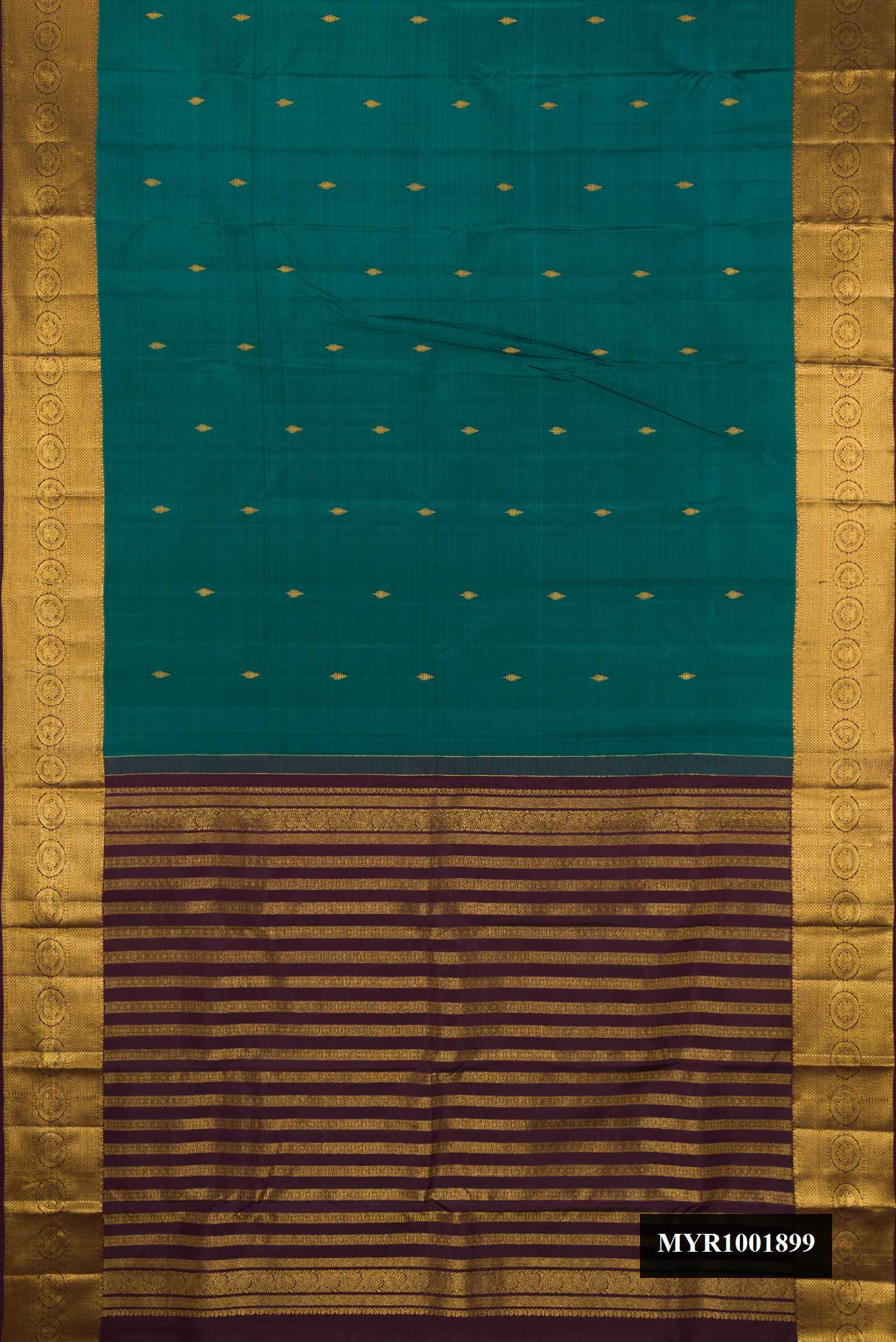 Green Dual Tone Kanchipuram Silk Saree with Zari Butta on the body and Zari Border.  displayed on a mannequin