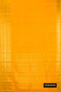 Mustard Dual Tone Kanchipuram Silk Saree with Zari Butta on the body and Zari Border.  displayed on a mannequin