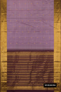 Lavender Dual Tone Kanchipuram Silk Saree with Zari Butta on the body and Zari Border.  displayed on a mannequin