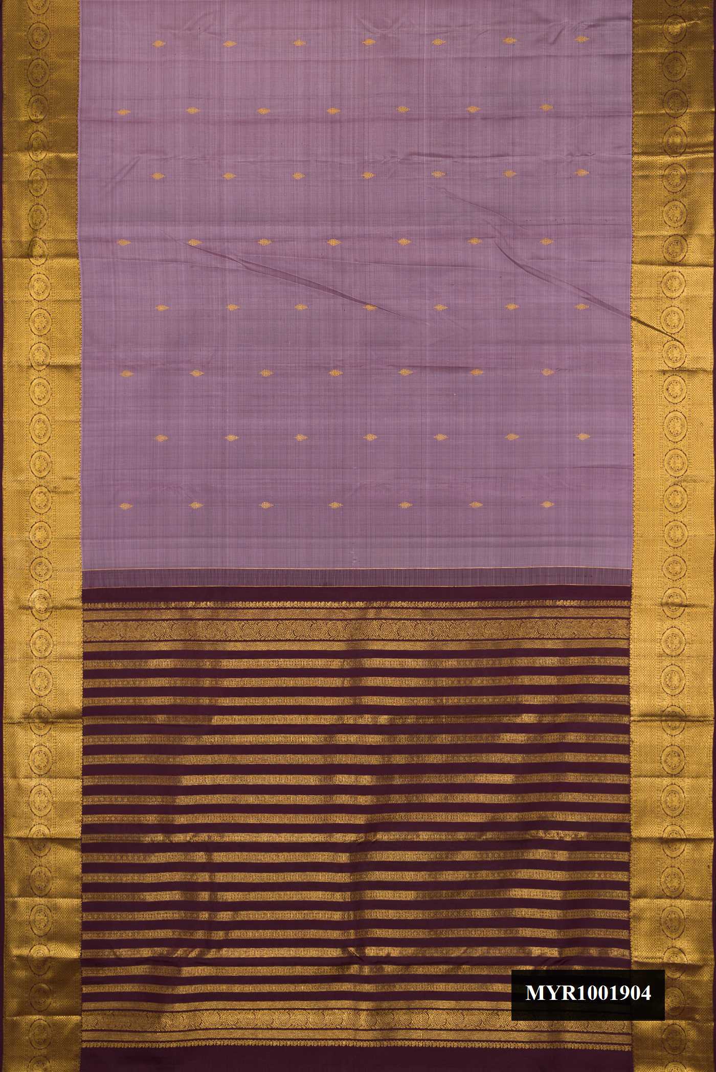 Lavender Dual Tone Kanchipuram Silk Saree with Zari Butta on the body and Zari Border.  displayed on a mannequin