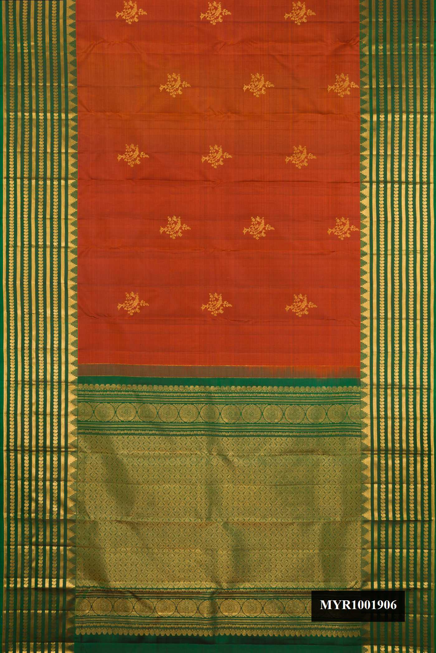 Rust Dual Tone Kanchipuram Silk Saree with Zari Butta on the body and Fancy Border.  displayed on a mannequin