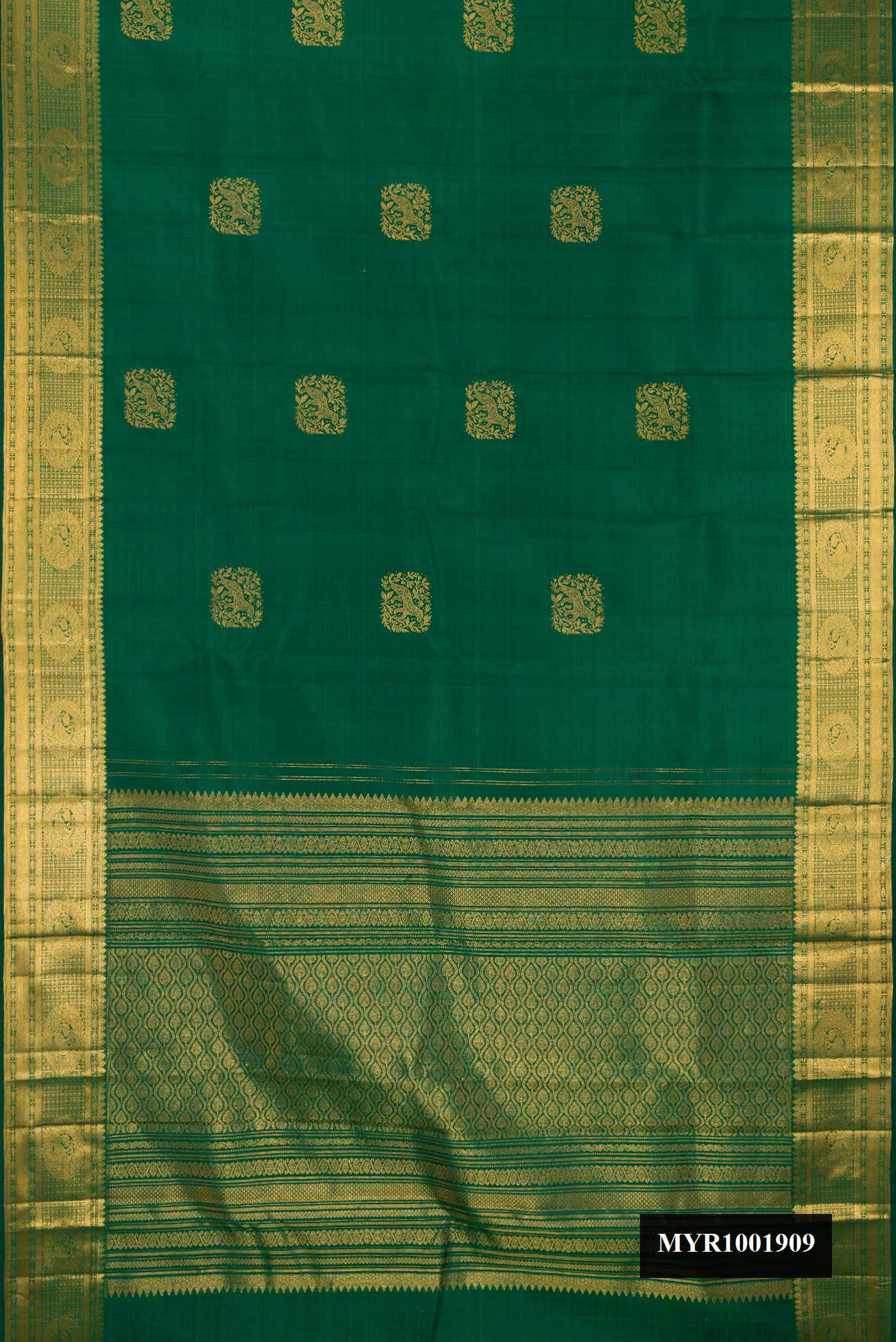Bottle Green Dual Tone Kanchipuram Silk Saree with Zari Butta on the body and Zari Border.  displayed on a mannequin
