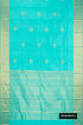 Sky Blue Dual Tone Kanchipuram Silk Saree with Zari Butta on the body and Zari Border.  displayed on a mannequin
