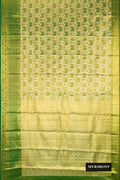 Green Dual Tone Kanchipuram Tissue Silk Saree with Zari Brocade on the body and Zari Border.  displayed on a mannequin