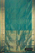 Peacock Blue Dual Tone Kanchipuram Silk Saree with Zari Brocade on the body and Zari Border.  displayed on a mannequin
