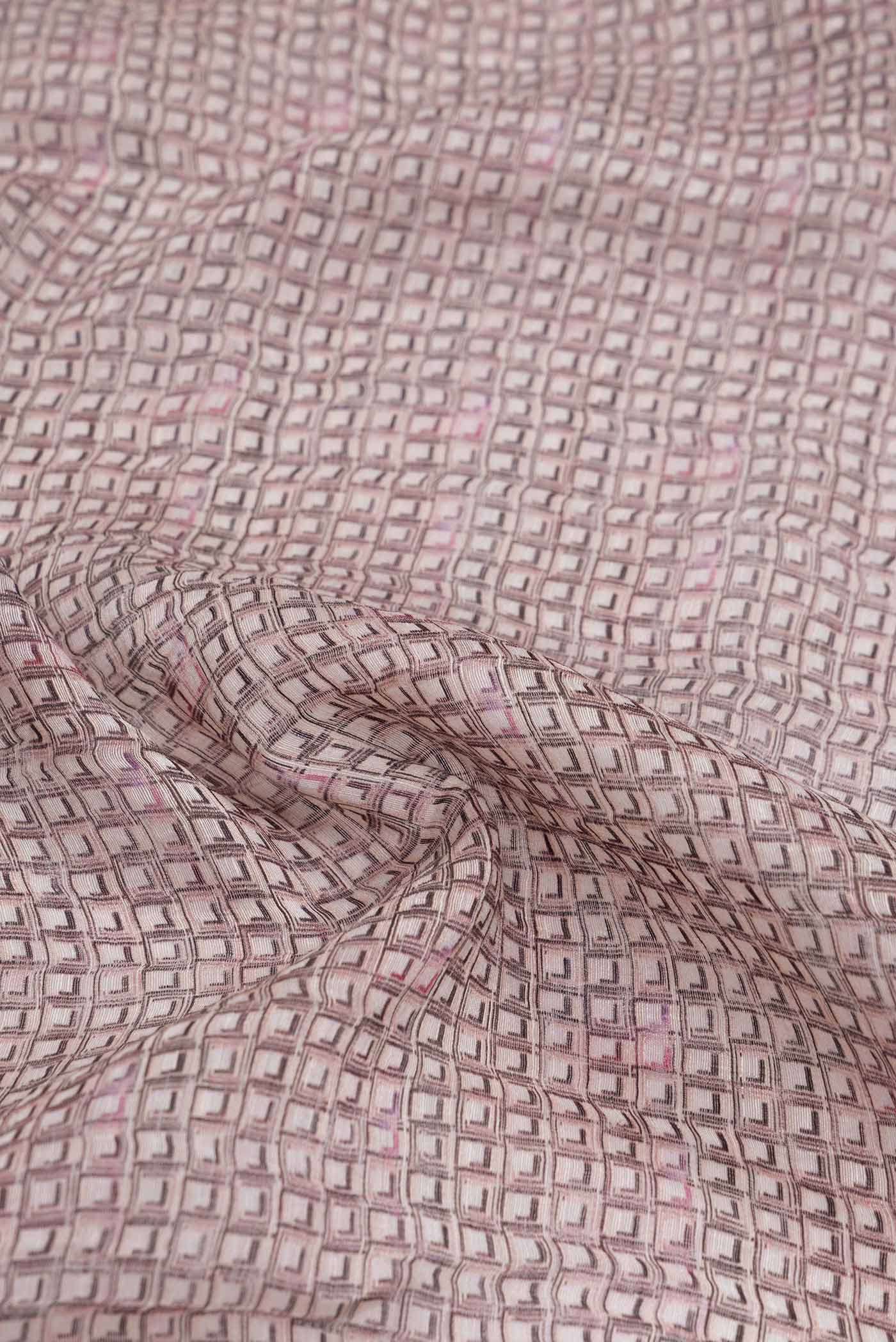 Close up of Golden Peach Dual Tone Linen Saree with Printed design on the body and Zari Border.  displaying folds