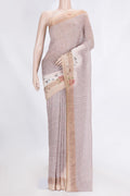 Golden Peach Dual Tone Linen Saree with Printed design on the body and Zari Border.  displayed on a mannequin