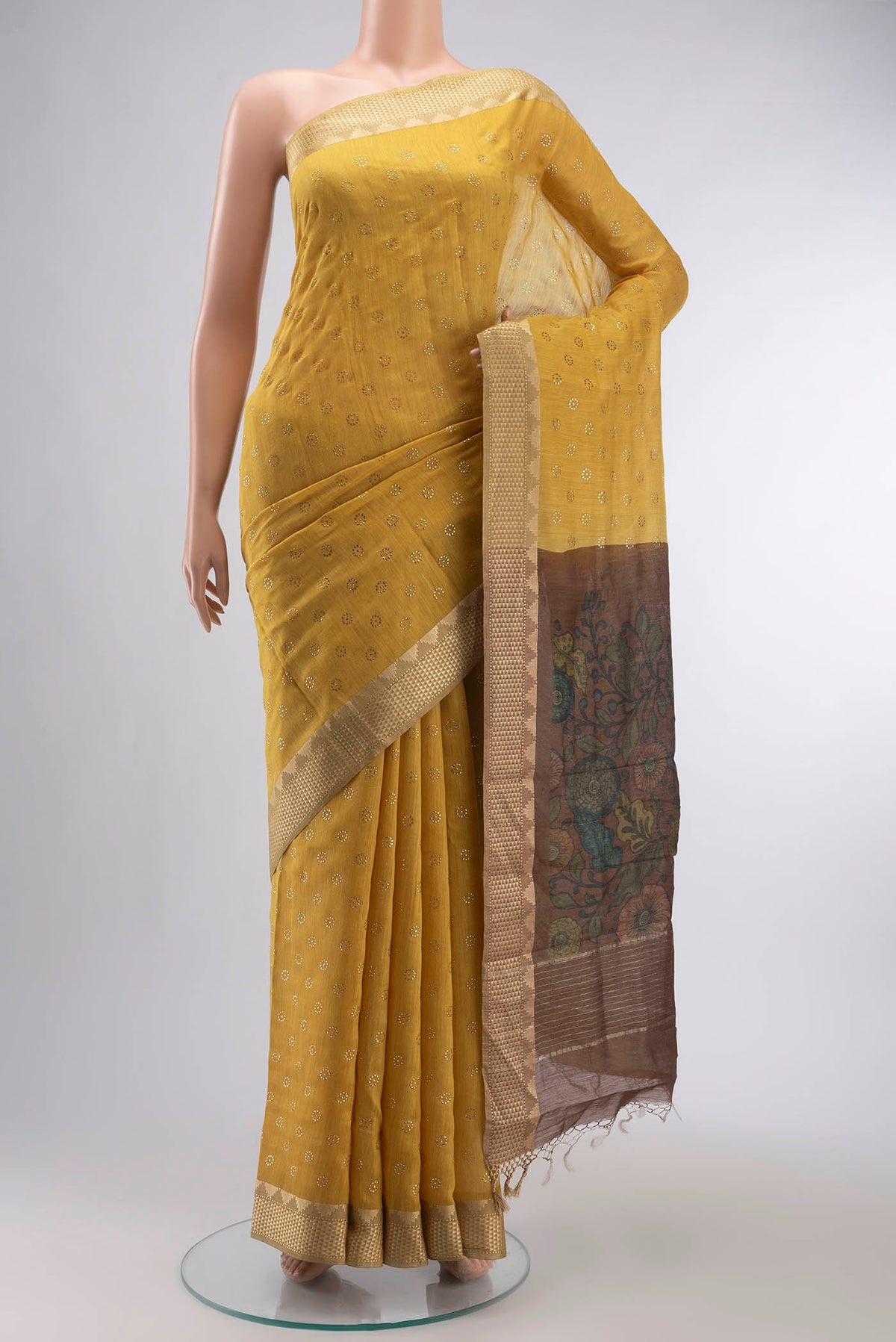 Yellow Bhagalpuri Tussar Silk Saree with Embroidery on the body and Zari Border displayed on a mannequin
