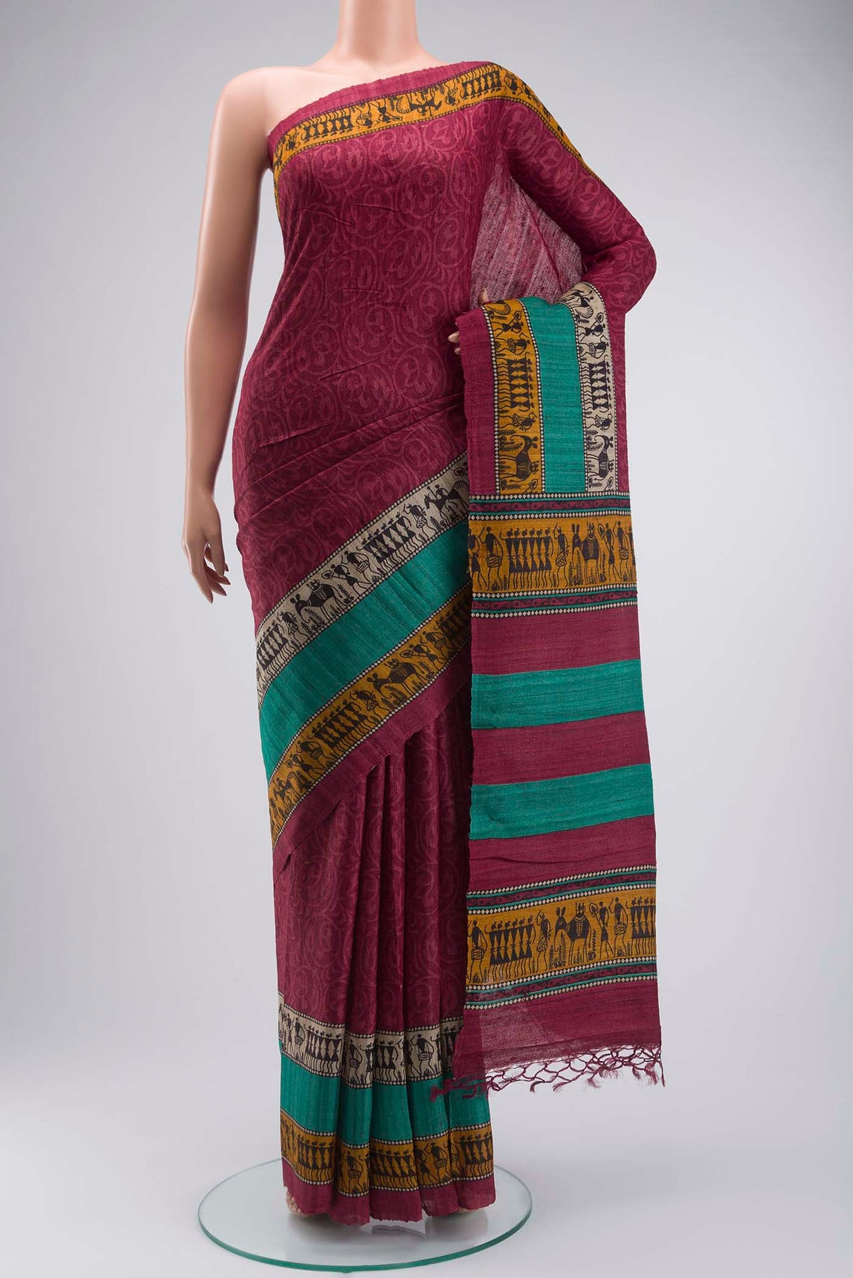 Maroon Tussar Silk Saree with Printed design on the body and Printed Border displayed on a mannequin
