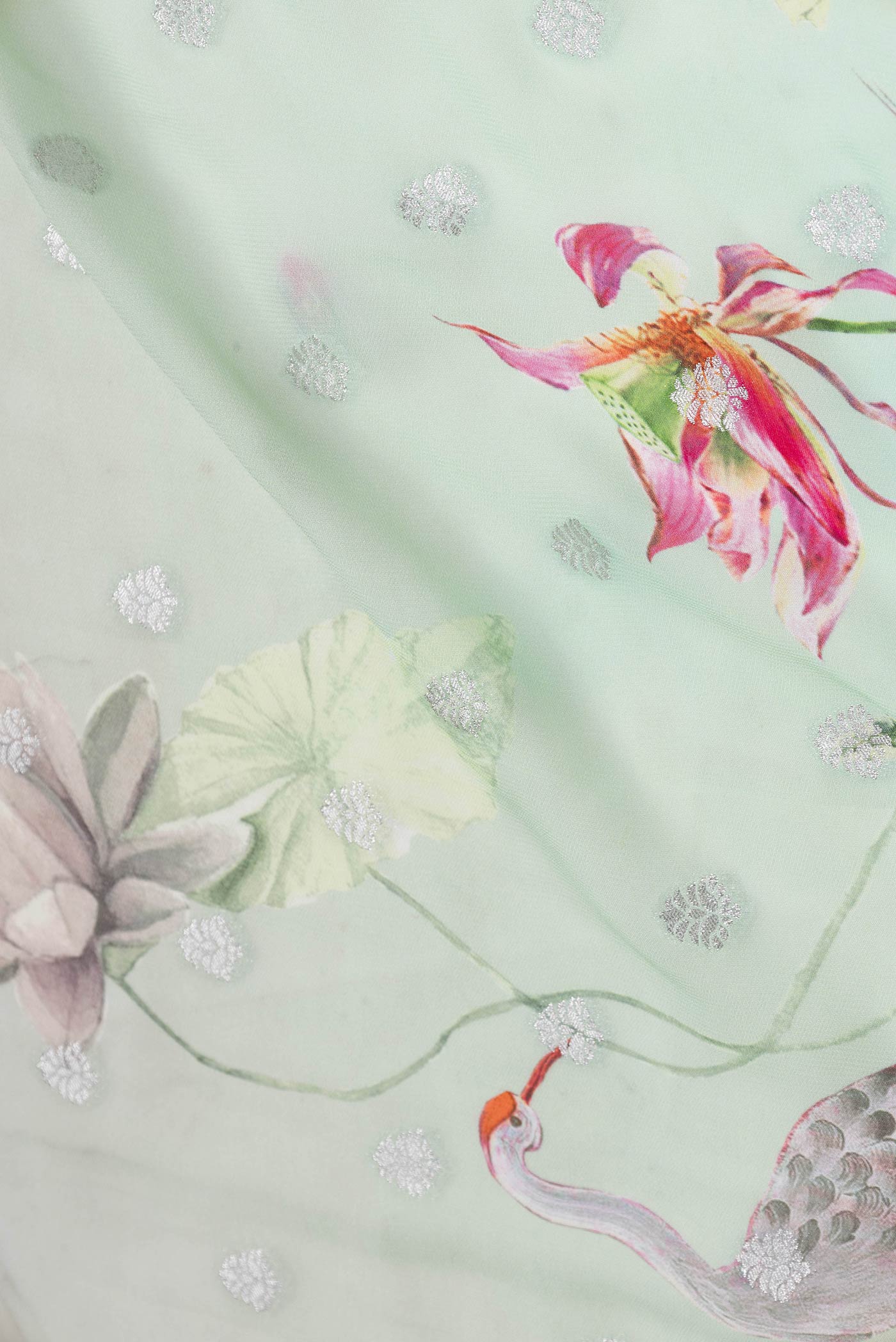 Close up of Multi Color Banarasi Georgette Saree with Zari Butta on the body and Zari Border displaying folds