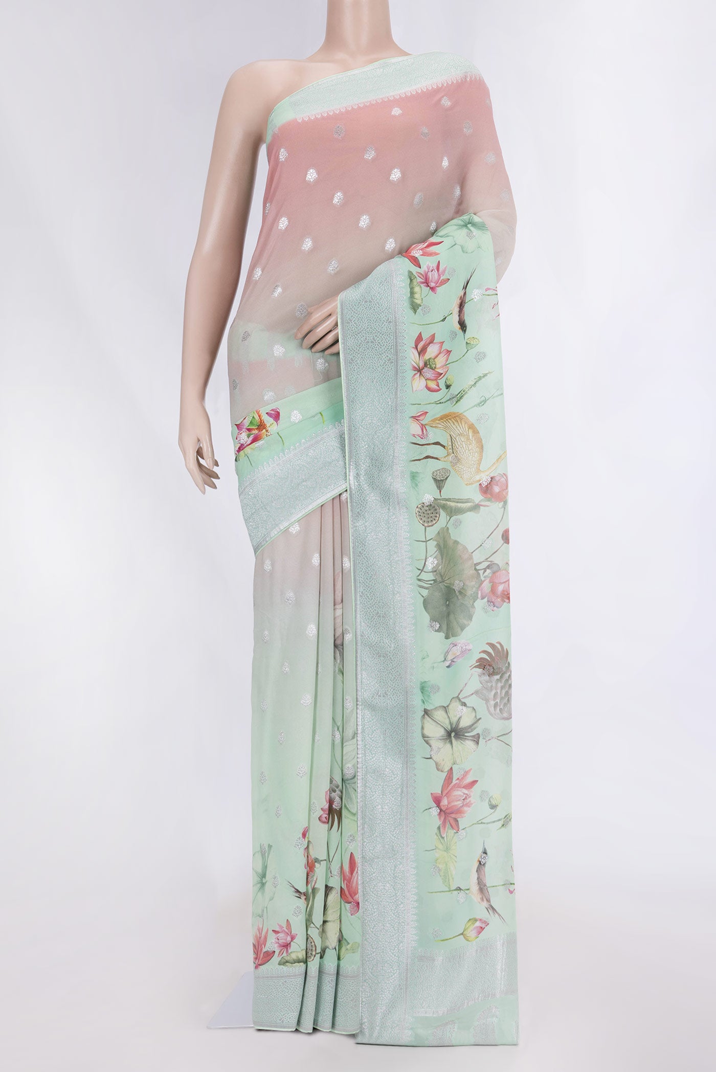 Multi Color Banarasi Georgette Saree with Zari Butta on the body and Zari Border displayed on a mannequin