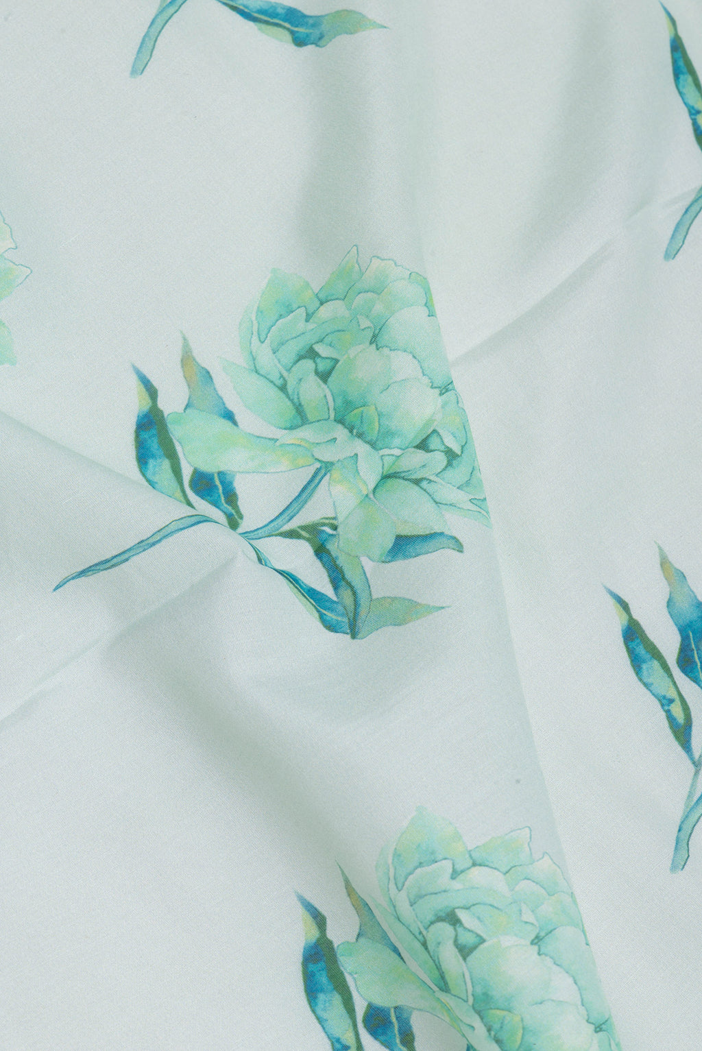 Close up of Light Blue Chanderi Silk Cotton Saree with Floral Print on the body and Fancy Border.  displaying folds