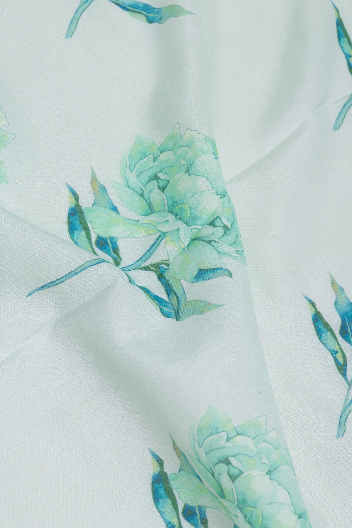 Close up of Light Blue Chanderi Silk Cotton Saree with Floral Print on the body and Fancy Border.  displaying folds