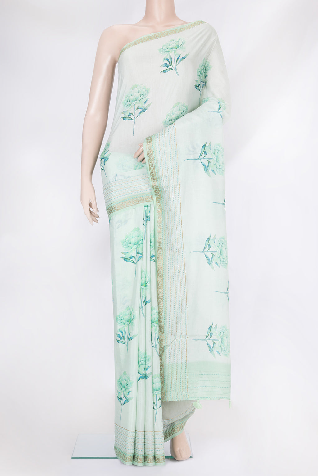 Light Blue Chanderi Silk Cotton Saree with Floral Print on the body and Fancy Border.  displayed on a mannequin