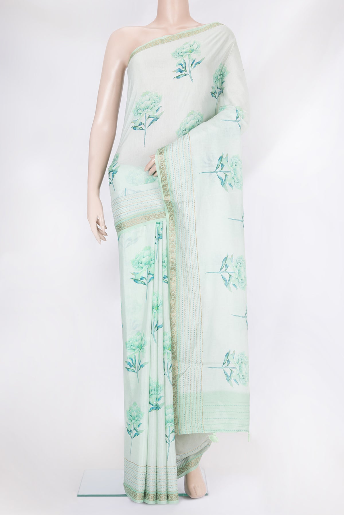 Light Blue Chanderi Silk Cotton Saree with Floral Print on the body and Fancy Border.  displayed on a mannequin