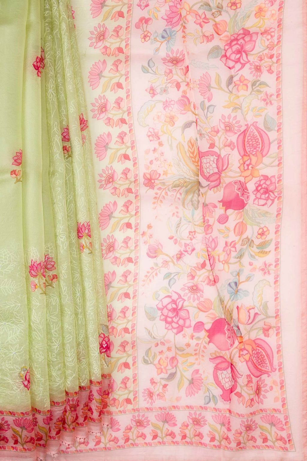 Pleats and pallu of Pista Green Dual Tone Organza Silk Saree with Embroidery on the body and Printed Border. 