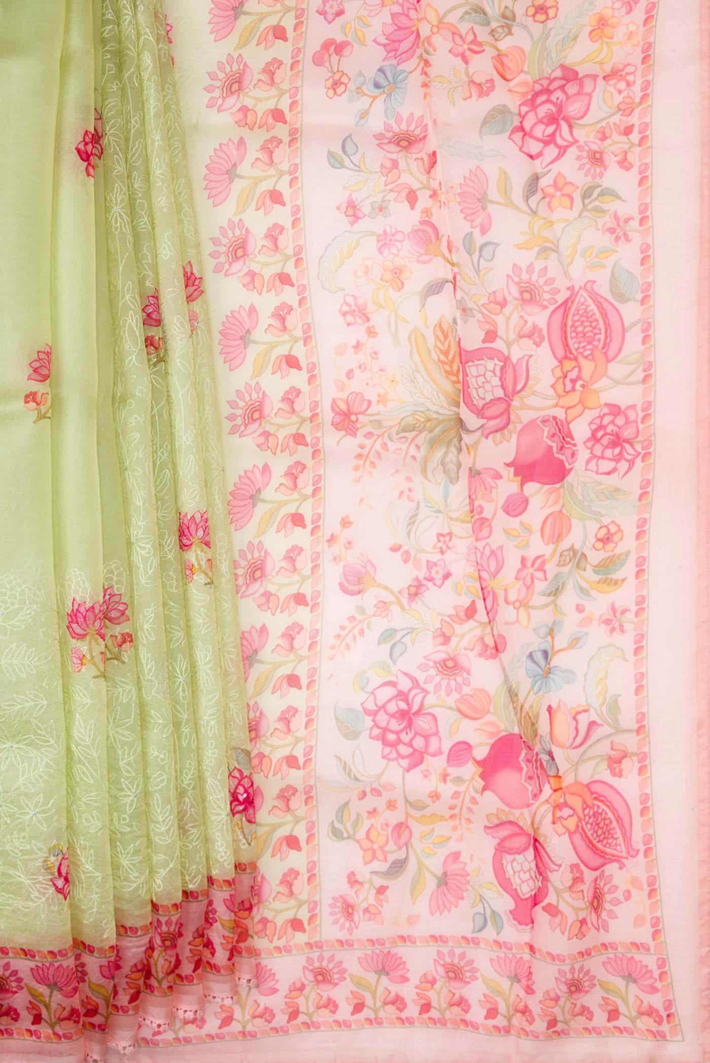 Pleats and pallu of Pista Green Dual Tone Organza Silk Saree with Embroidery on the body and Printed Border. 