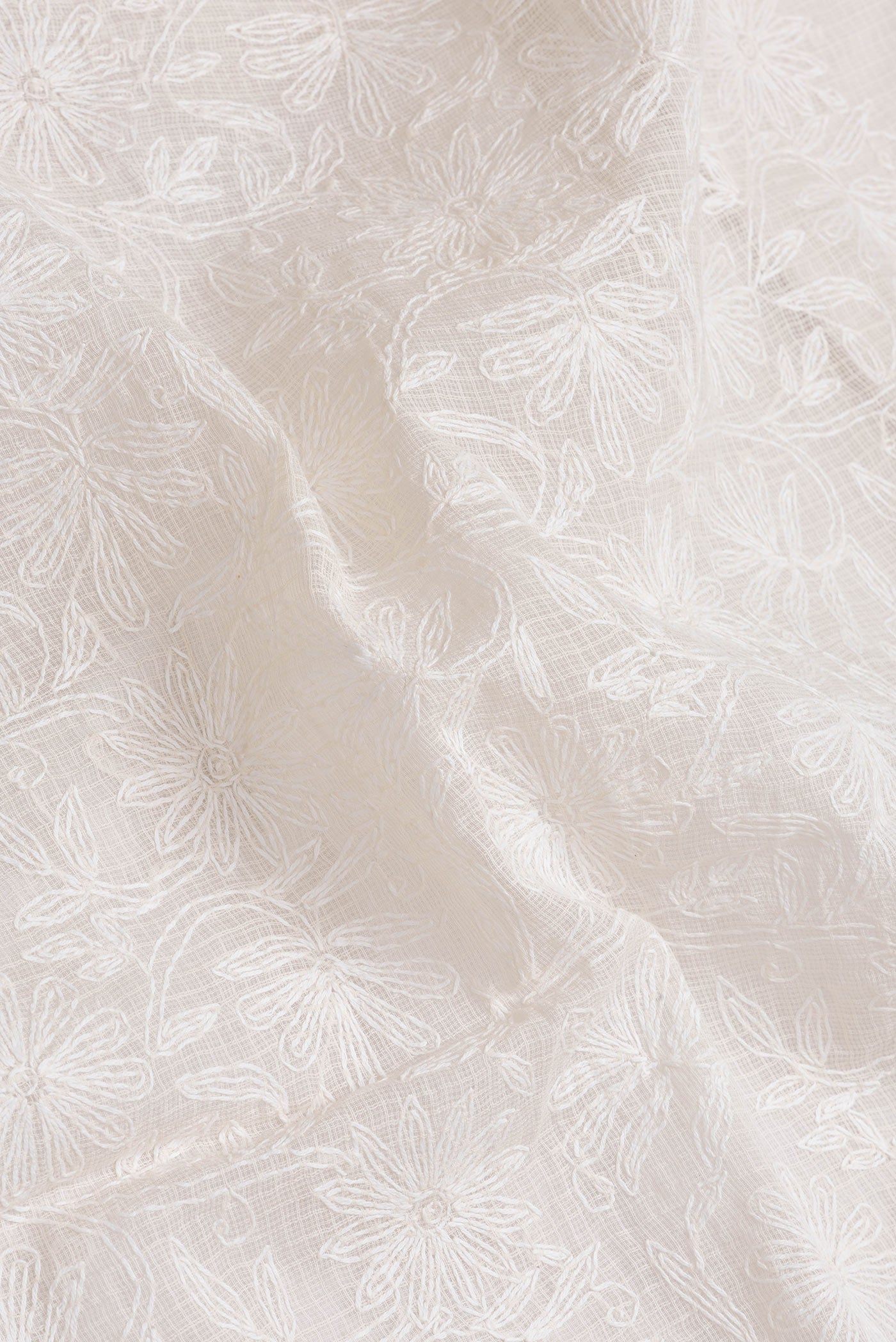 Close up of Beige Dual Tone Kota Silk Saree with Embroidery on the body and Zari Border.  displaying folds