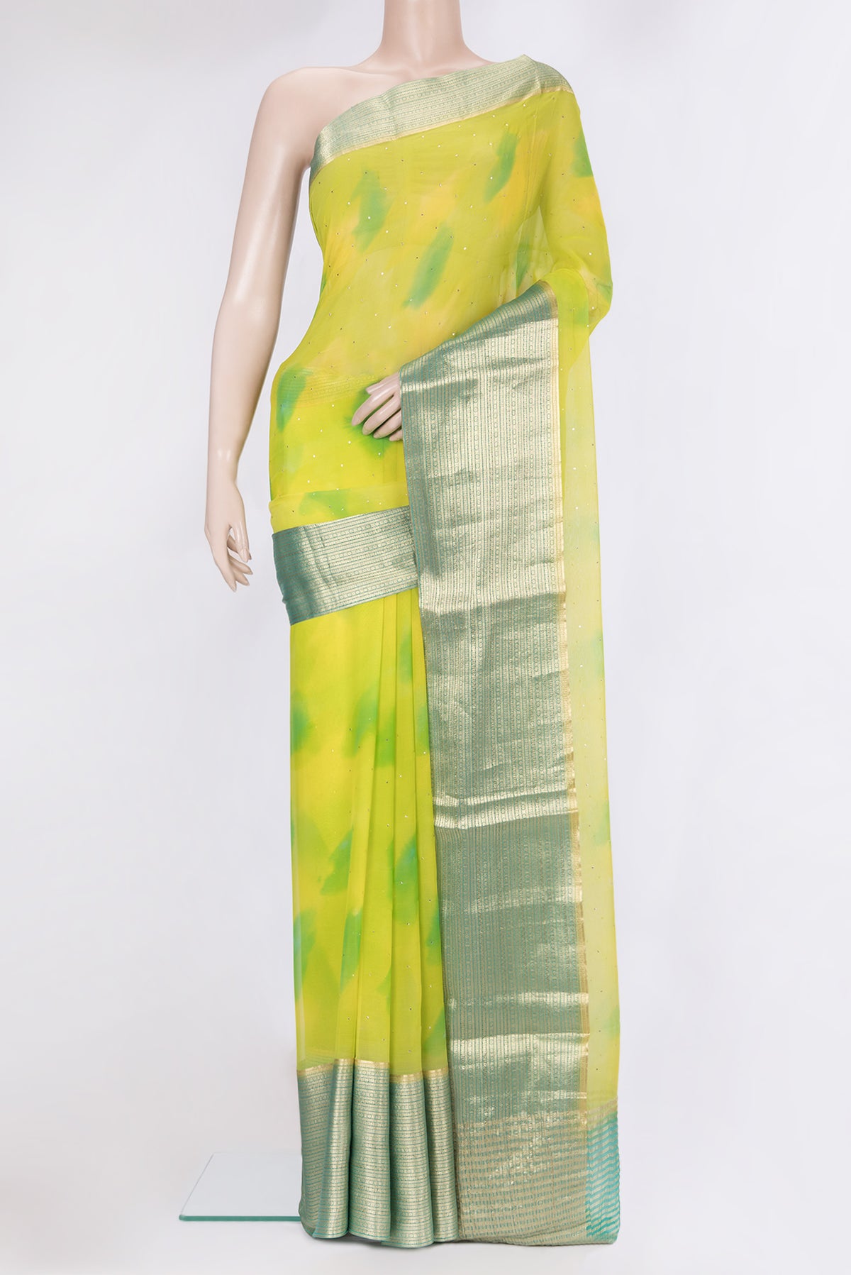 Parrot Green Dual Tone Mysore Chiffon Saree with Embroidery on the body and Zari Border.  displayed on a mannequin