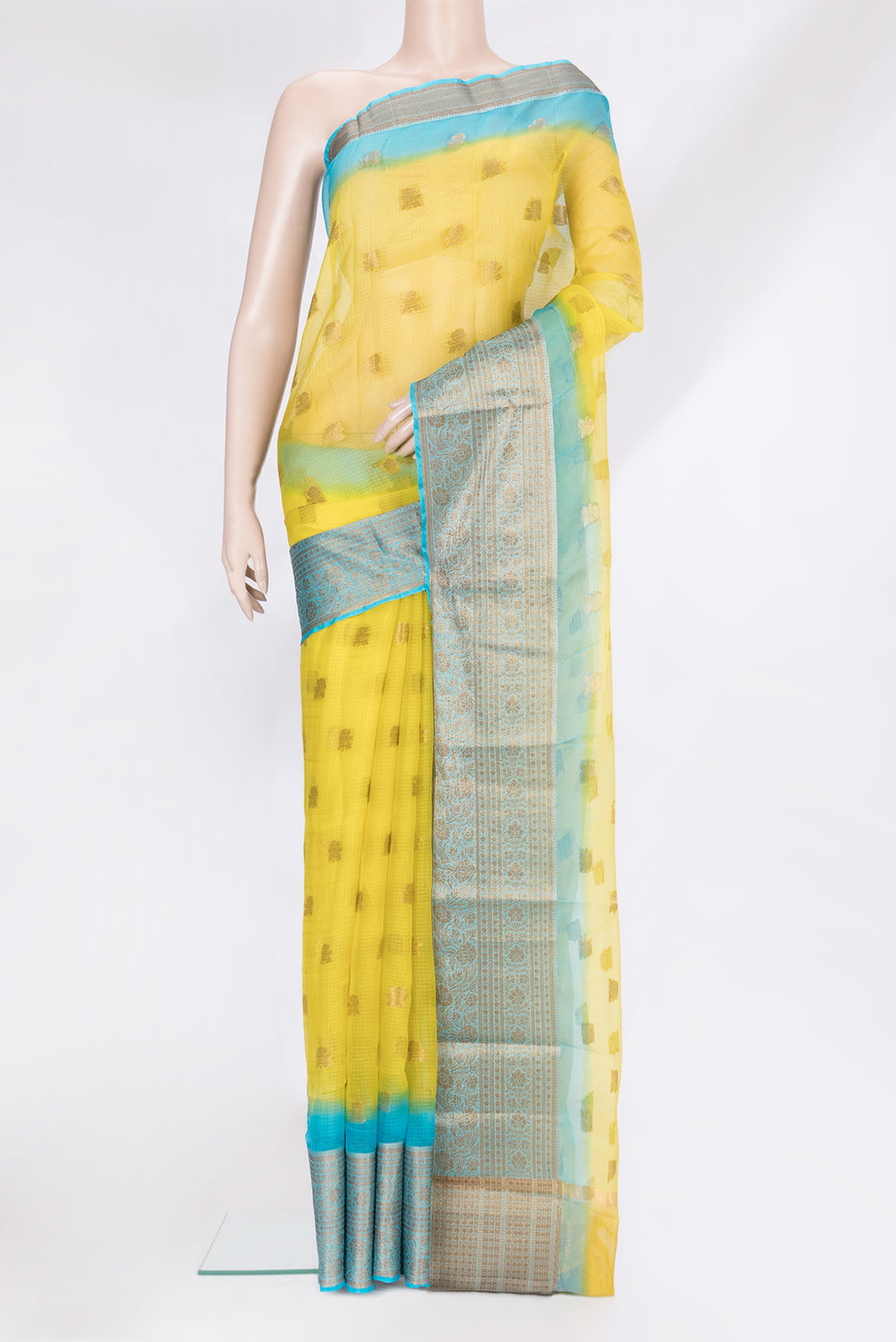Yellow Kota Silk Saree with Zari Butta on the body and Zari Border.  displayed on a mannequin