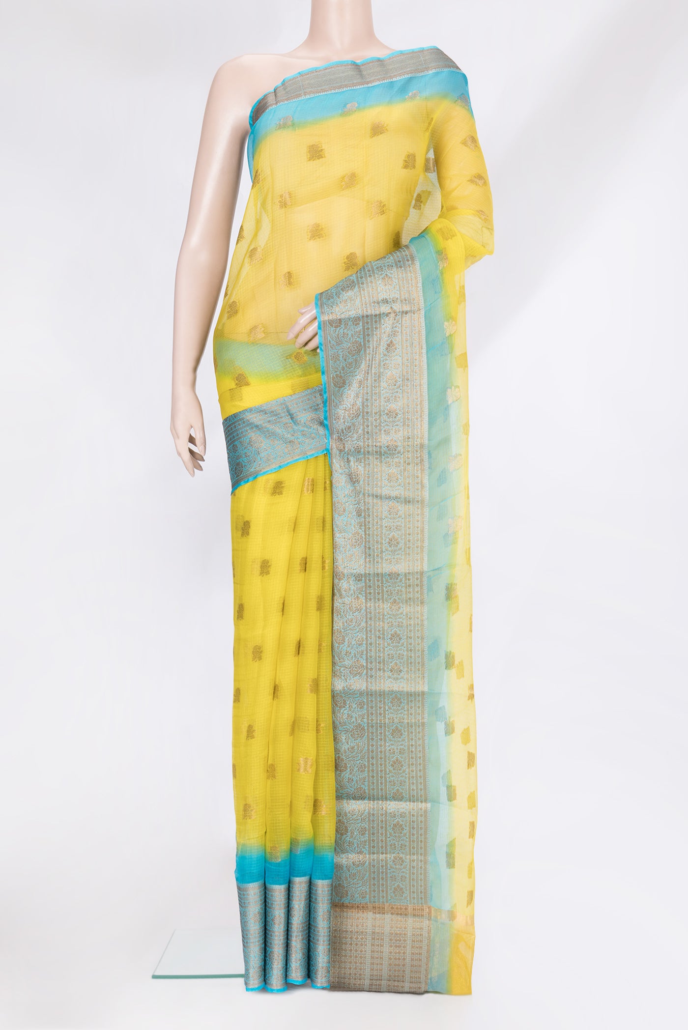 Yellow Kota Silk Saree with Zari Butta on the body and Zari Border.  displayed on a mannequin