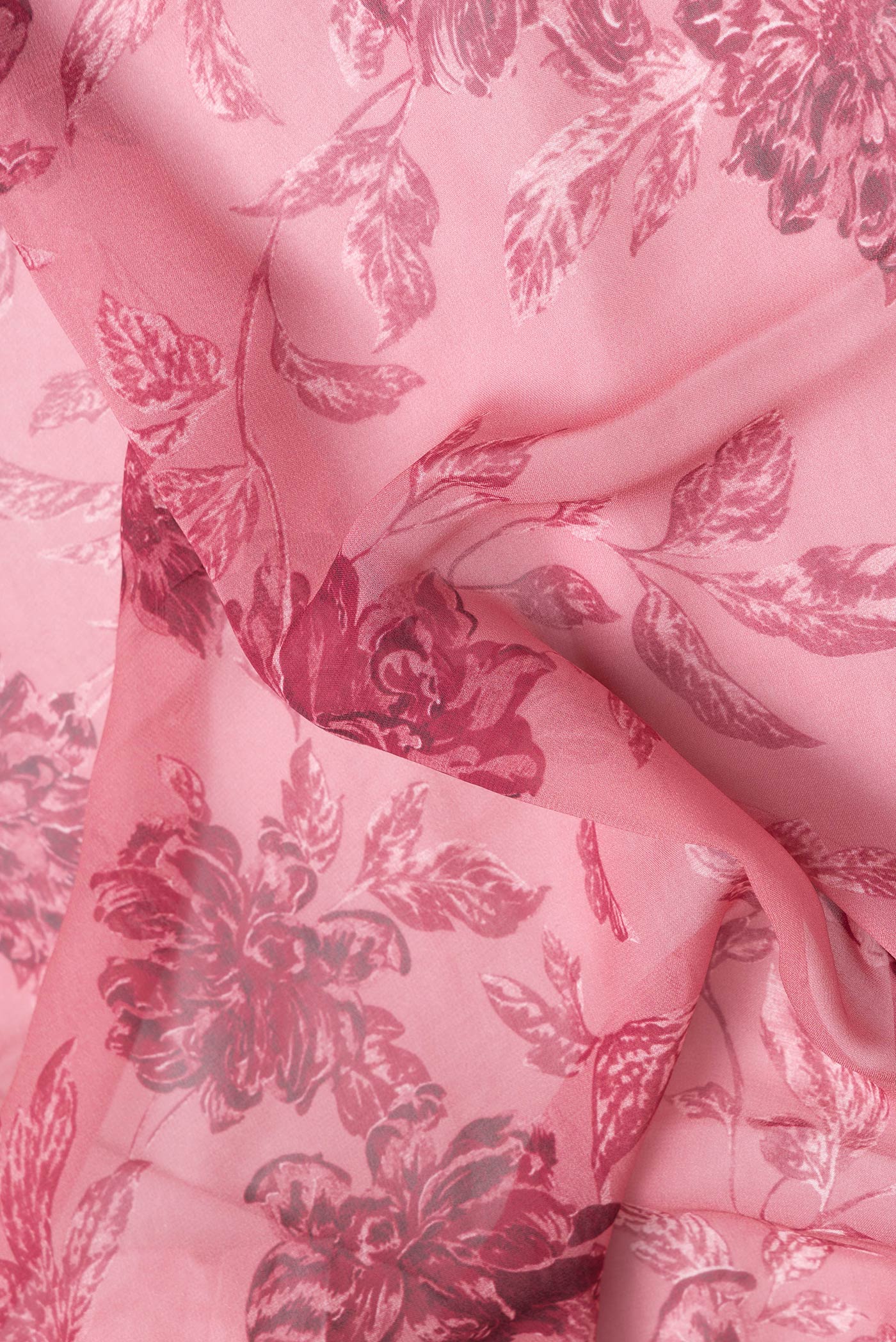 Close up of Pink Dual Tone Mysore Georgette Saree with Printed design on the body and Without Border.  displaying folds