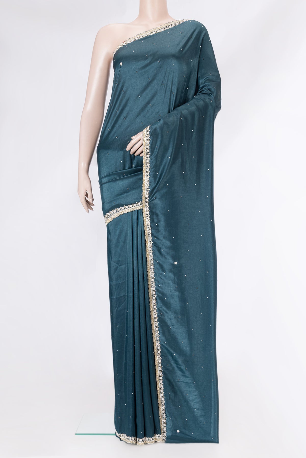Peacock Blue Dual Tone Mysore Crepe Saree with Embroidery on the body and Embroidery Border.  displayed on a mannequin