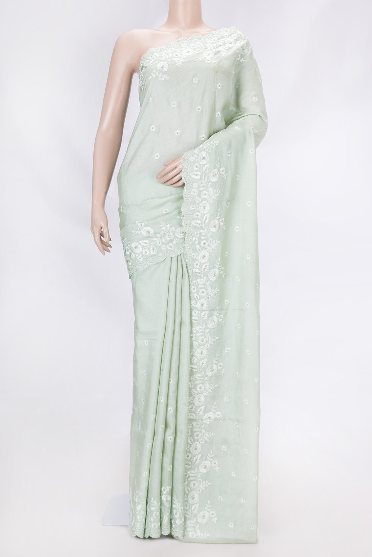 Pista Green Dual Tone Tussar Saree with Embroidery on the body and Embroidery Border displayed on a mannequin