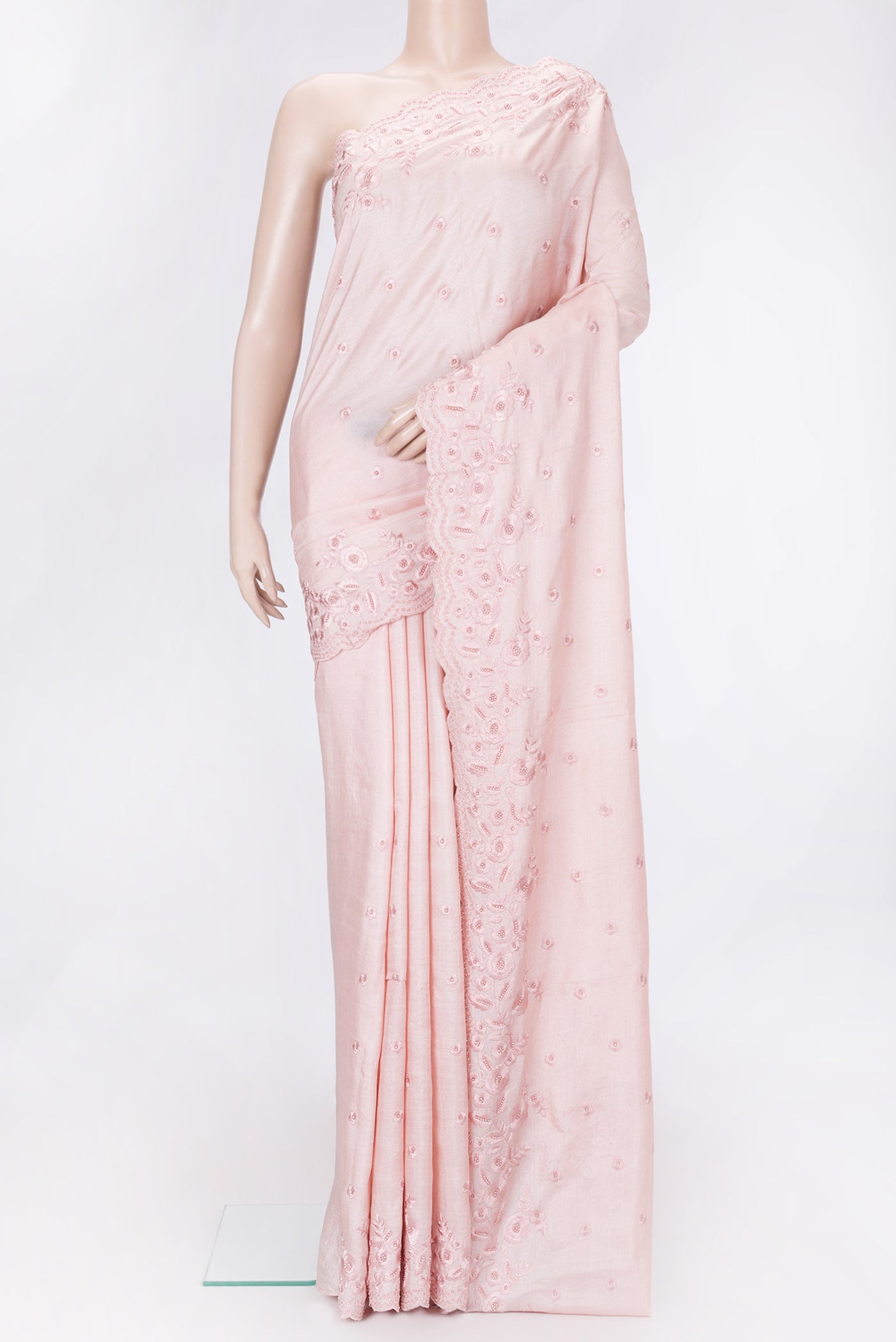 Rose Gold Dual Tone Tussar Silk Saree with Embroidery on the body and Embroidery Border.  displayed on a mannequin