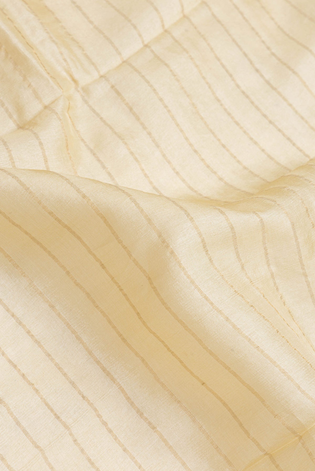 Close up of Sandal Dual Tone Tussar Silk Saree with Stripes on the body and Embroidery Border.  displaying folds