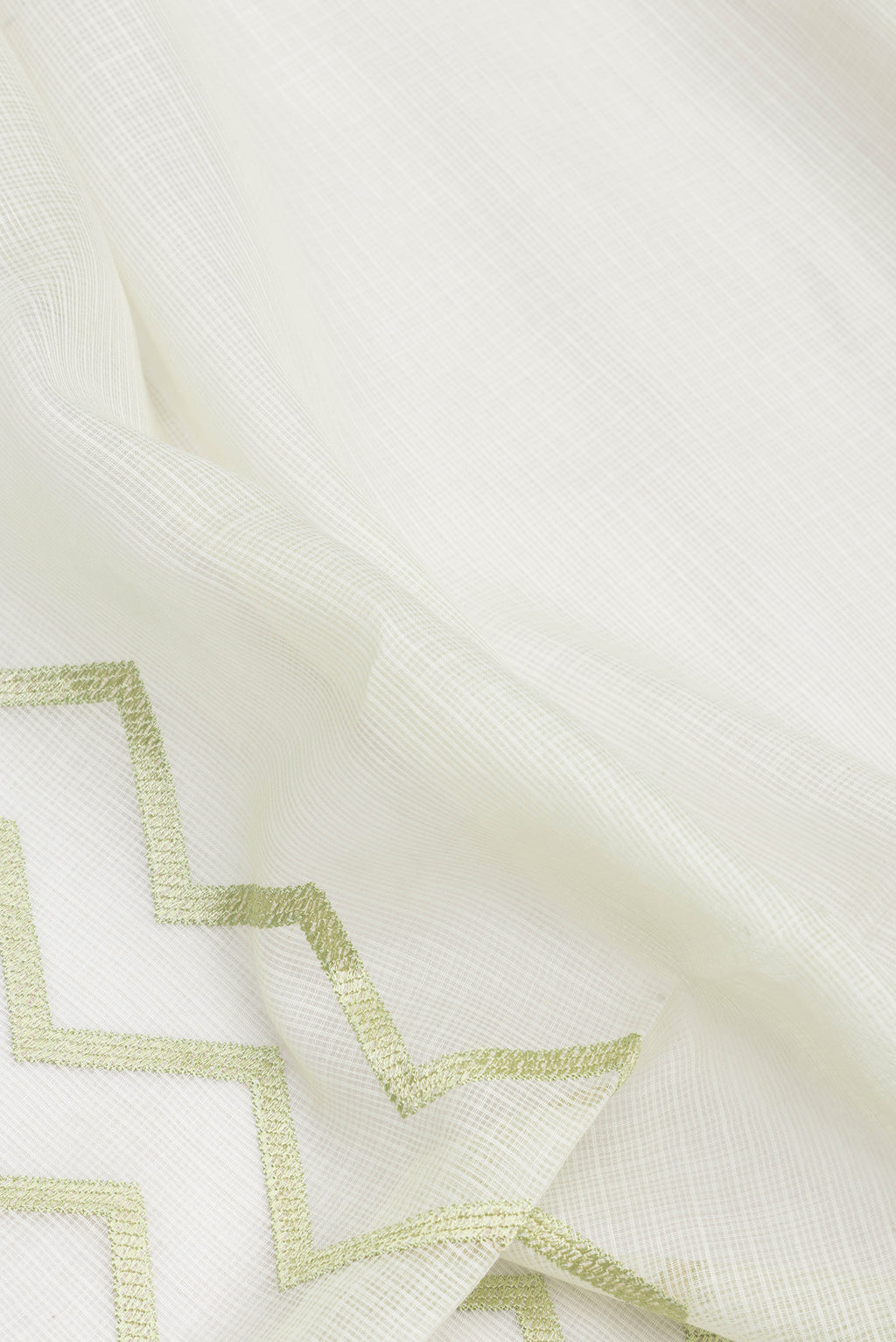 Close up of Pista Green Dual Tone Kota Silk Saree with Embroidery on the body and Embroidery Border.  displaying folds