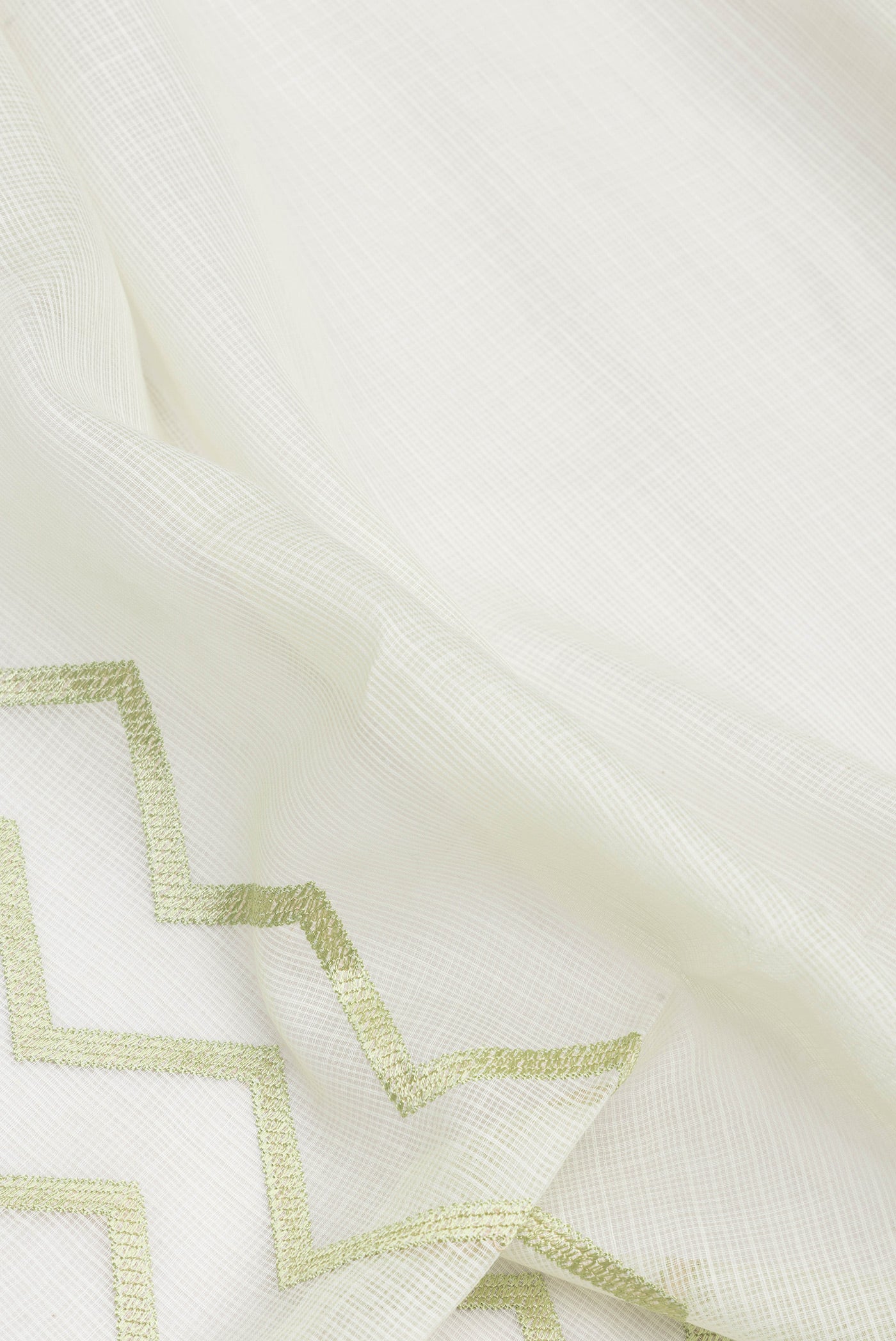 Close up of Pista Green Dual Tone Kota Silk Saree with Embroidery on the body and Embroidery Border.  displaying folds