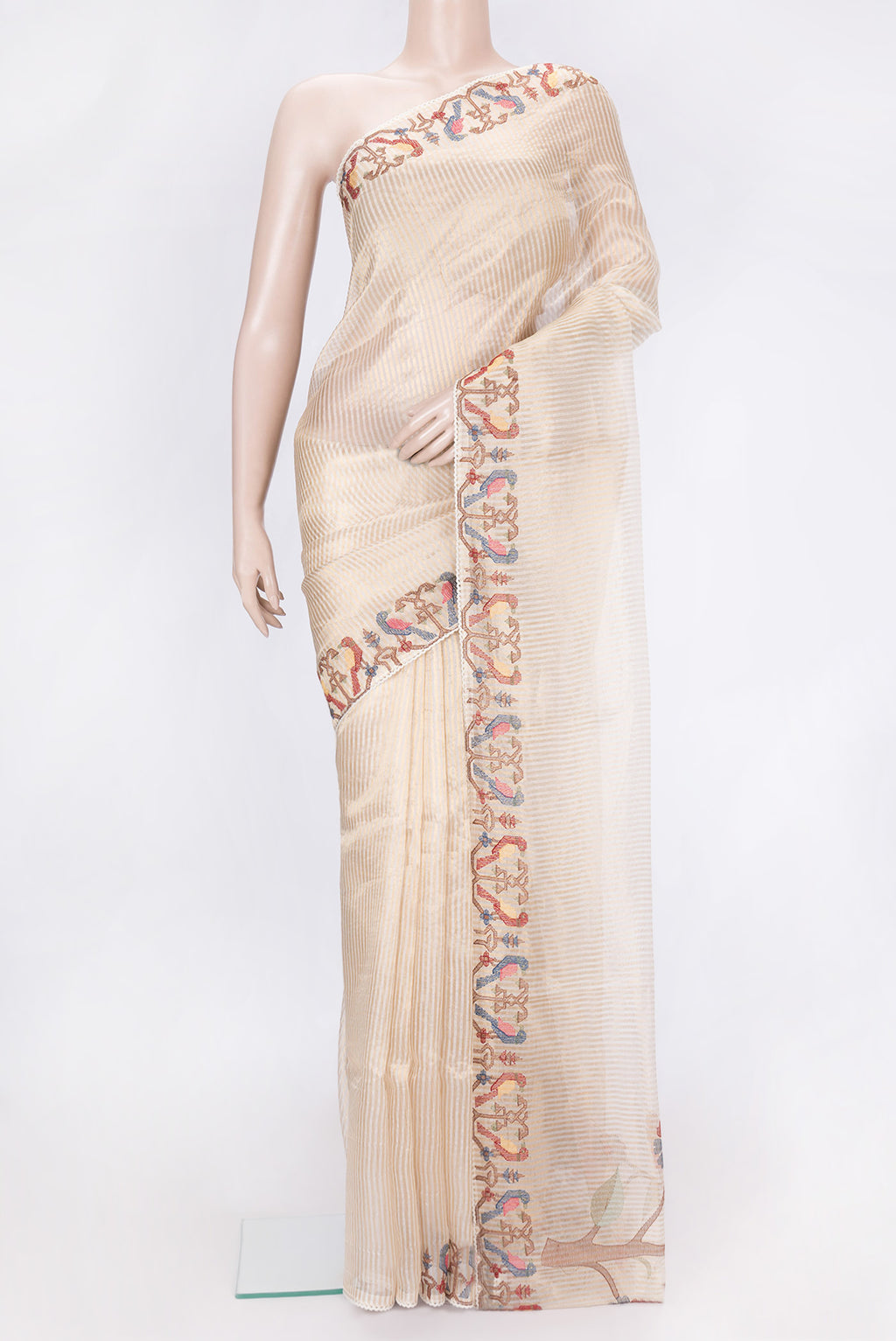 Beige Dual Tone Organza Silk Saree with Stripes on the body and Embroidery Border.  displayed on a mannequin