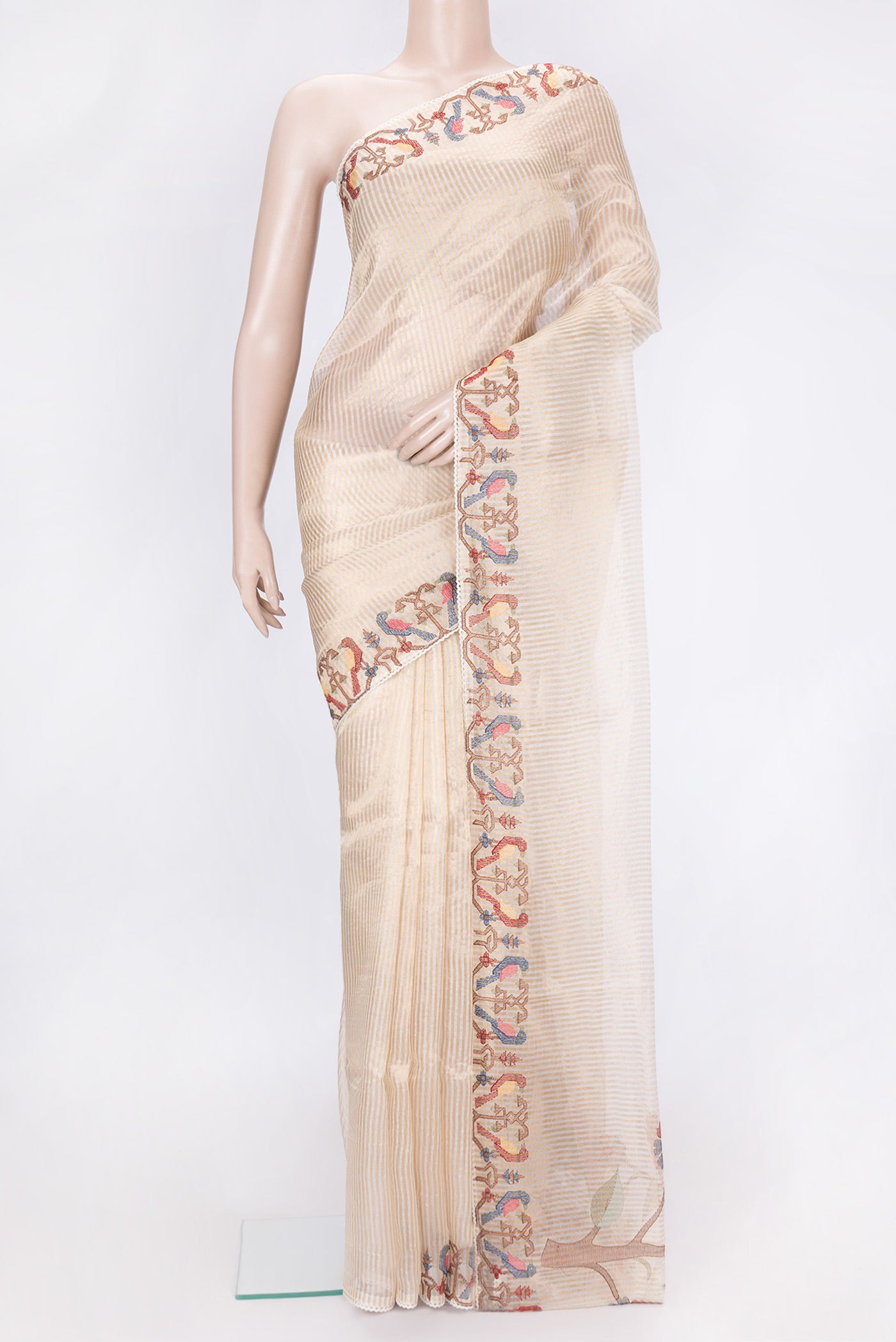Beige Dual Tone Organza Silk Saree with Stripes on the body and Embroidery Border.  displayed on a mannequin