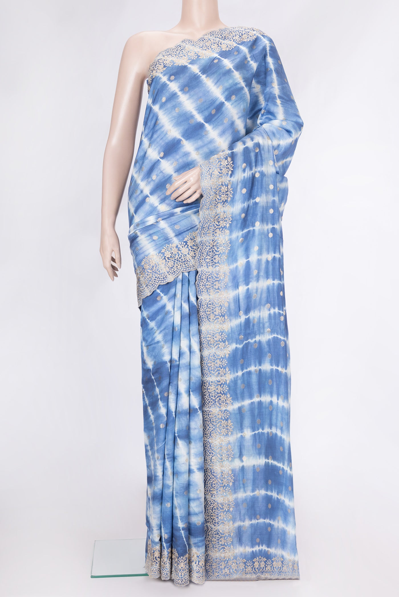 Peacock Blue Dual Tone Tussar Silk Saree with Zari Butta on the body and Embroidery Border.  displayed on a mannequin