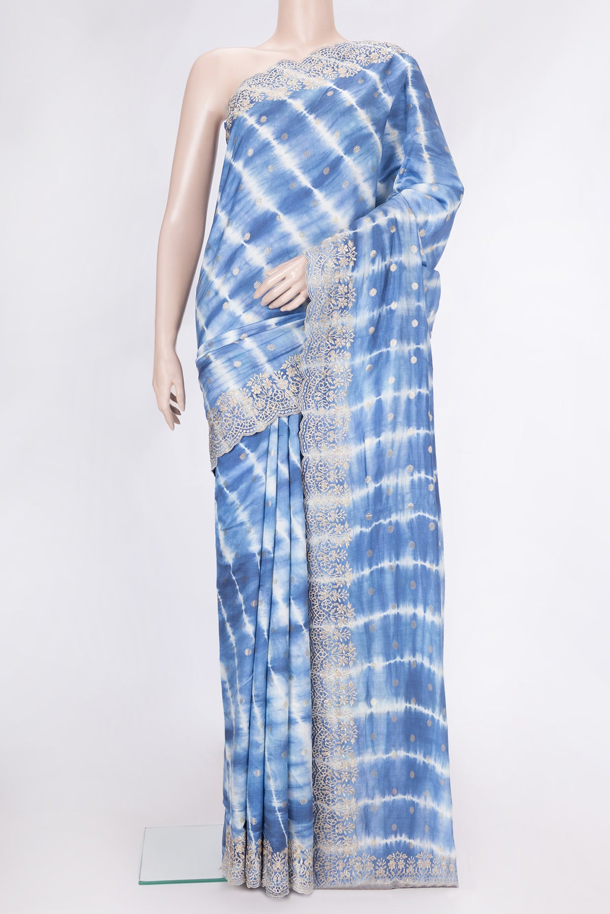 Peacock Blue Dual Tone Tussar Silk Saree with Zari Butta on the body and Embroidery Border.  displayed on a mannequin