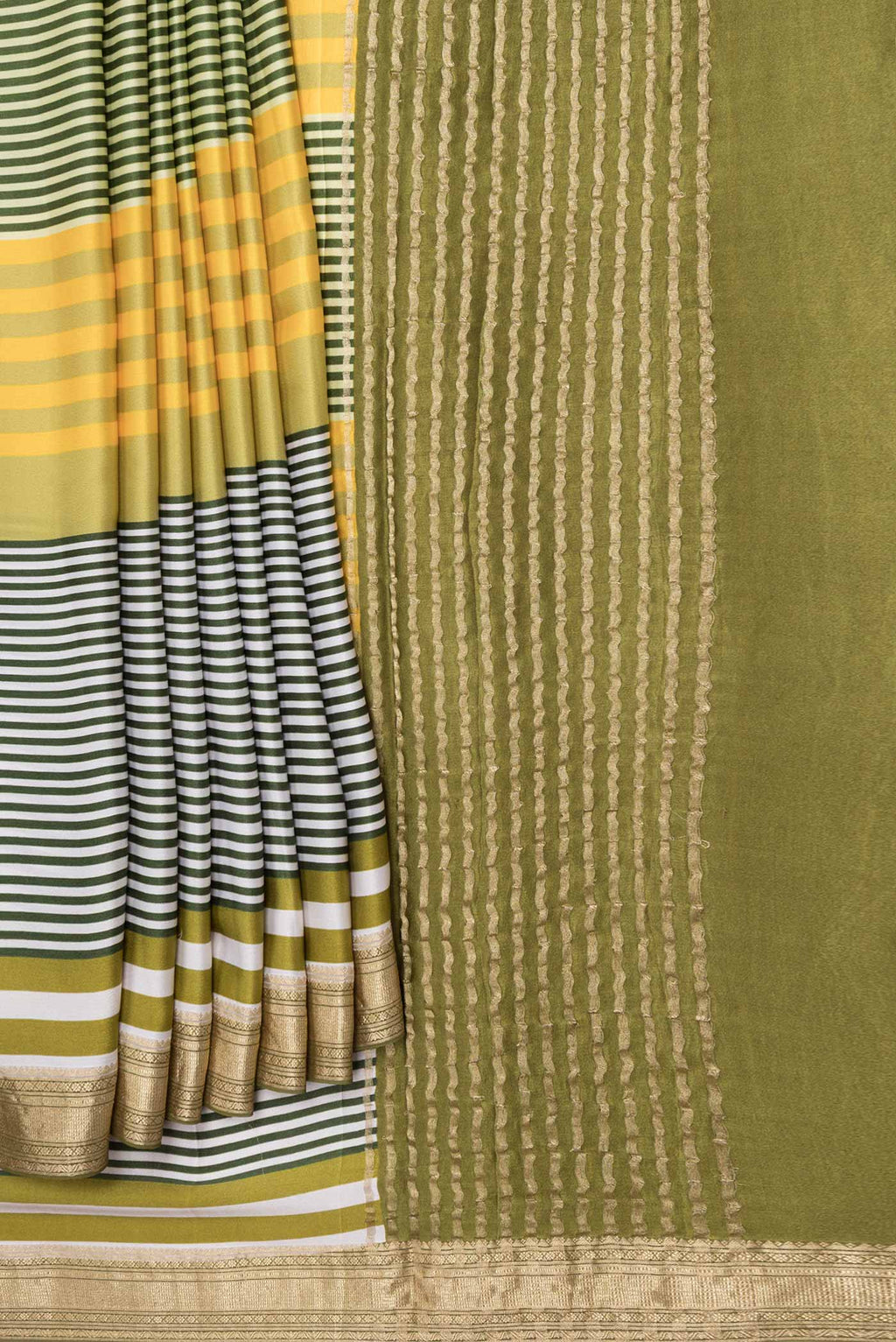 Pleats and pallu of Green Satin Silk Saree with Geometric Print on the body and Zari Border