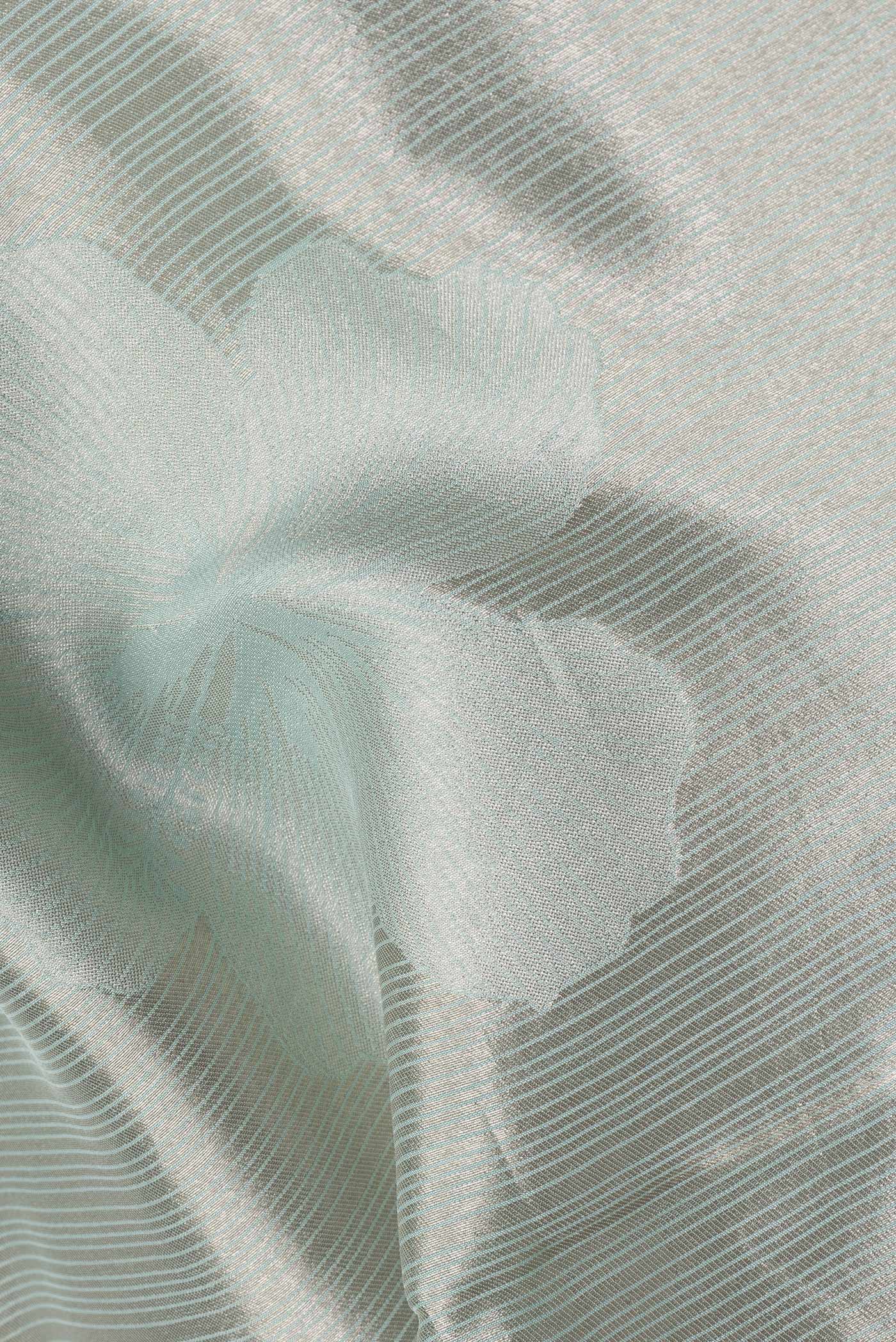 Close up of Sea Green Dual Tone Mysore Georgette Saree with Embroidery on the body and Embroidery Border.  displaying folds