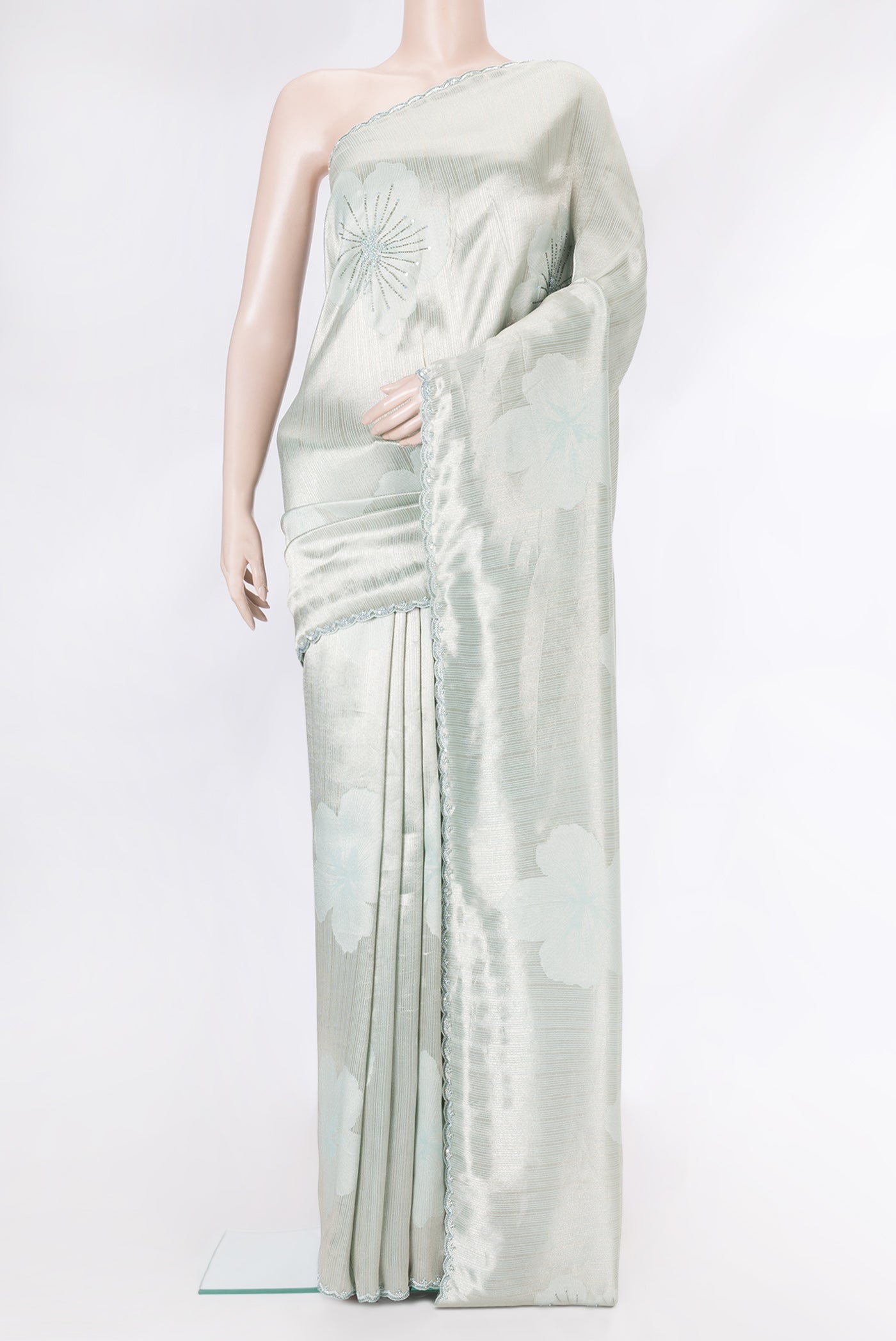 Sea Green Dual Tone Mysore Georgette Saree with Embroidery on the body and Embroidery Border.  displayed on a mannequin