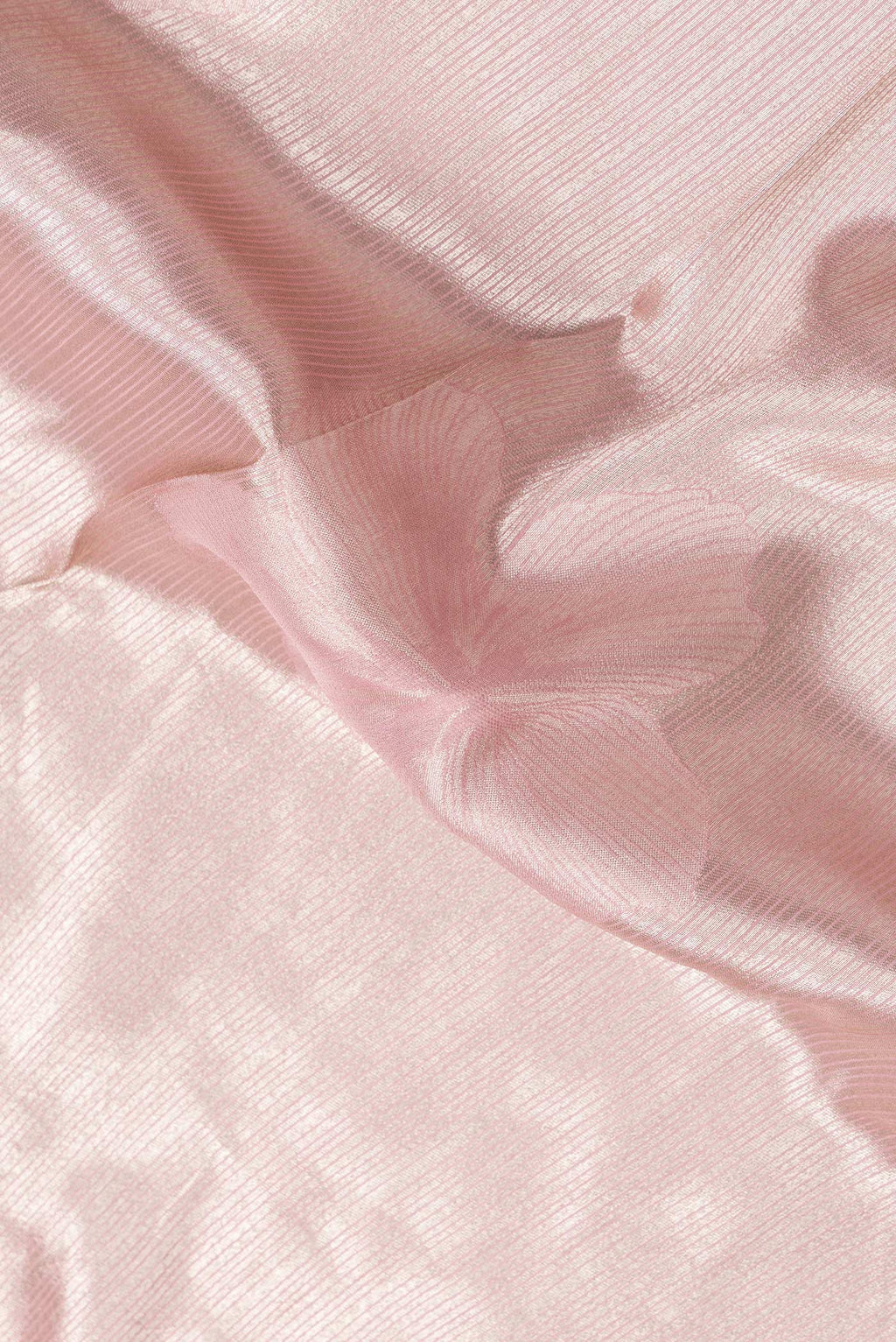 Close up of Pink Dual Tone Mysore Georgette Saree with Zari Brocade on the body and Embroidery Border.  displaying folds